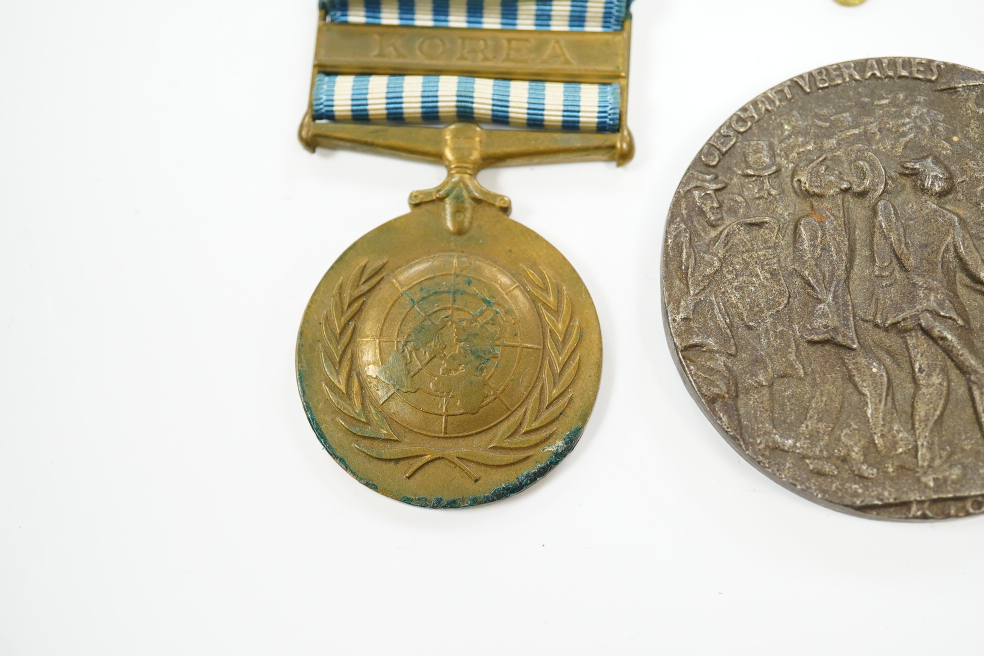 A First World War medal pair awarded to SJT. F.C. Howkins, The Queen’s R., together with a QEII Korea medal pair awarded to CPL. T.A. Howkins, R. Norfolk, plus a Lusitania propaganda medallion, all contained in a Princes